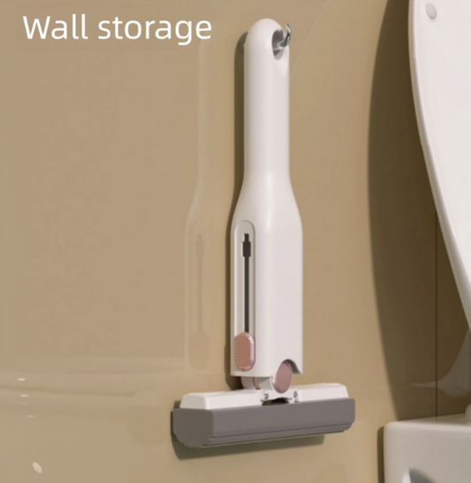A white handheld mini portable cleaning mop is attached to a beige wall with the text 'Wall storage.'