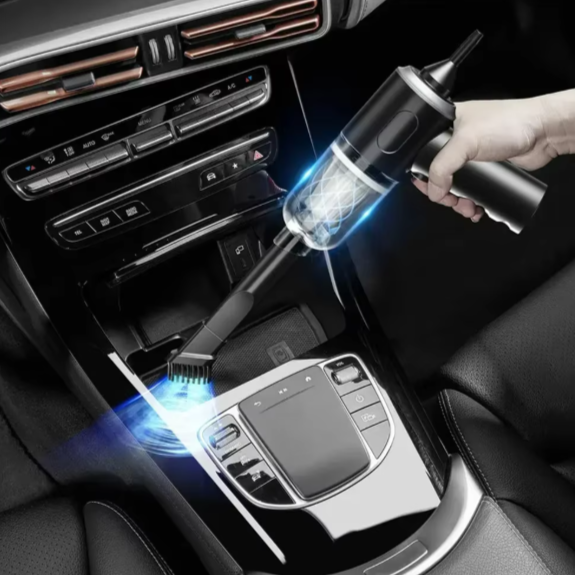 Car interior cleaning tool being used to clean a car console.